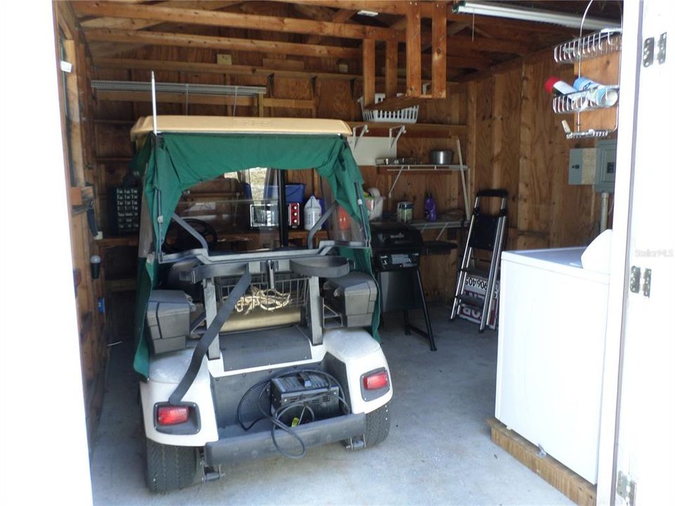 Interior view of storage shed with room to park a golf cart