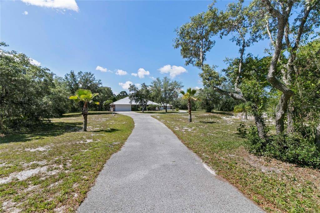 Long driveway from the house to detached workshop