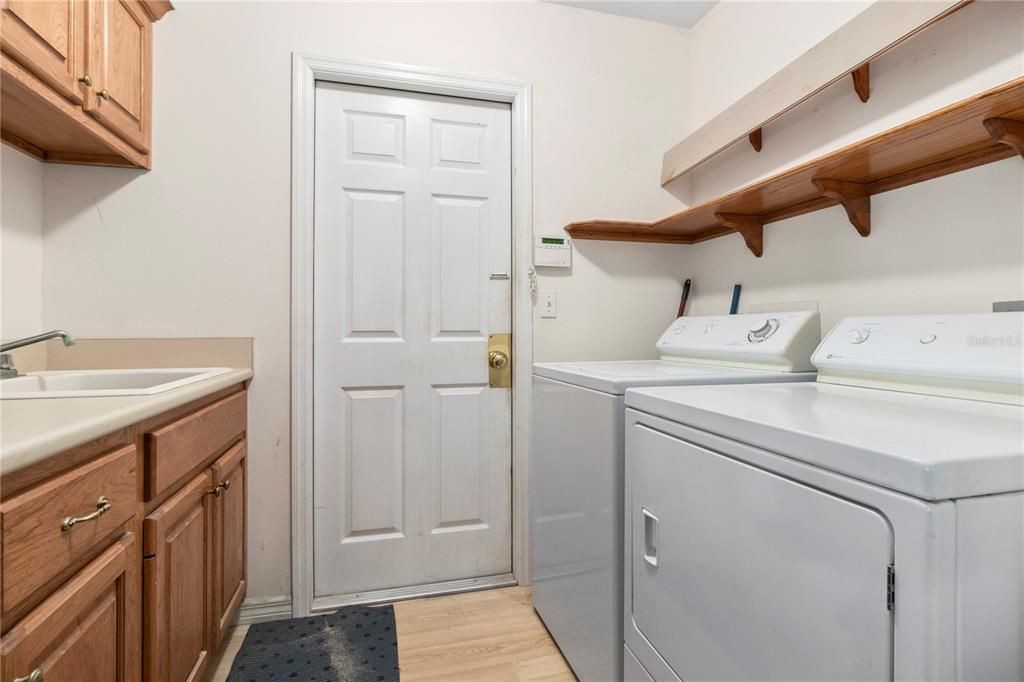 Laundry room leading to the attached garage