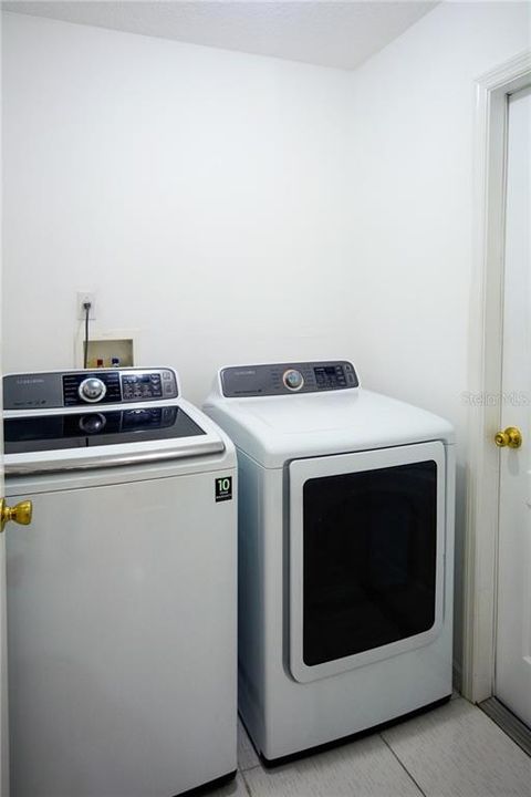 Inside Laundry Room with included Washer and Dryer