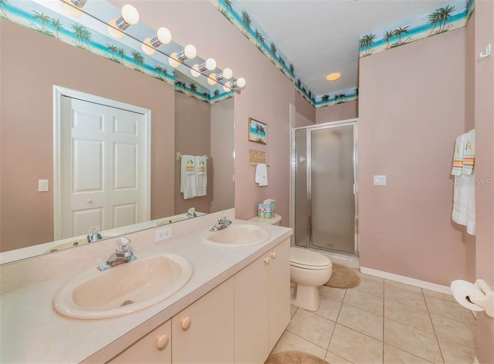 Owner's Bathroom, with Shower and large walk-in Closet on RIGHT but showing deceivingly in vanity mirror as on Left? Trust me, it belongs on Right!