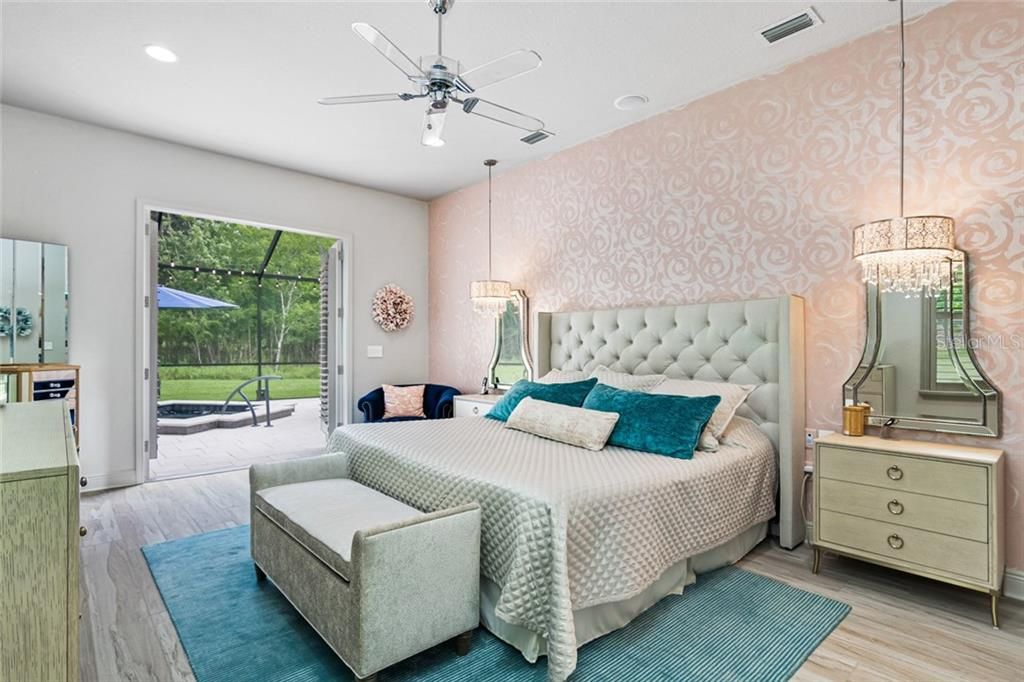 Master Bedroom with Open French Doors to the Lanai and Spa