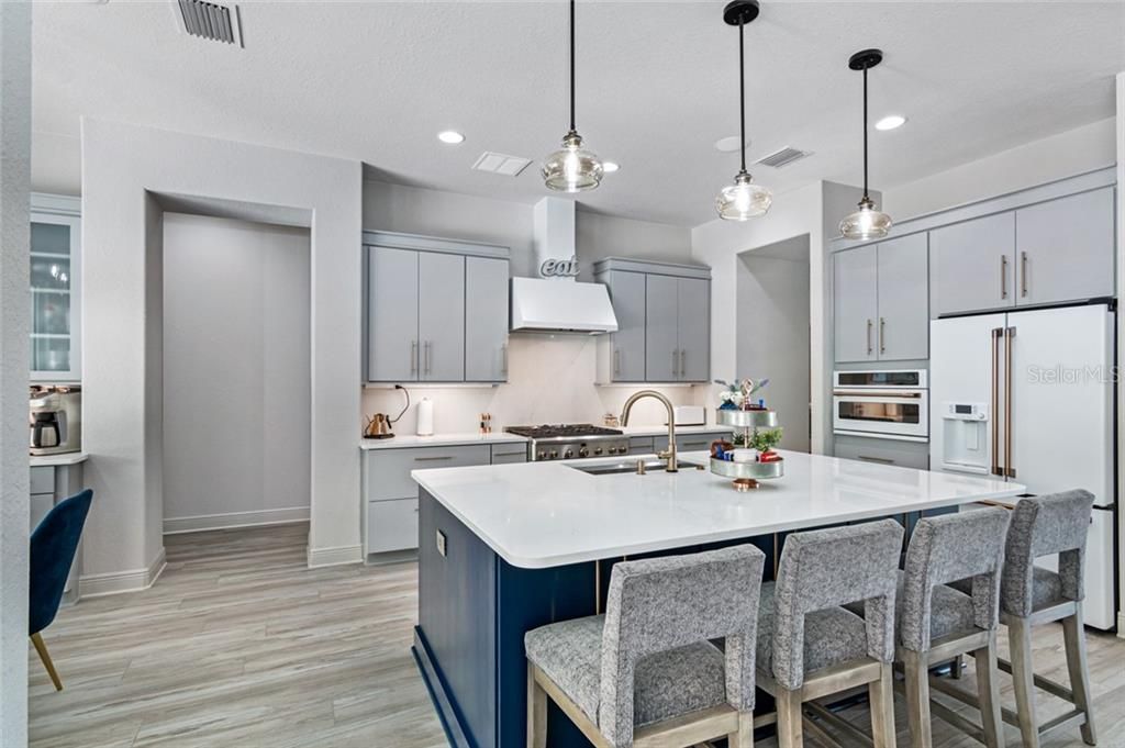 Kitchen, Quartz Oversized Island has cabinets on both sides for extra storage