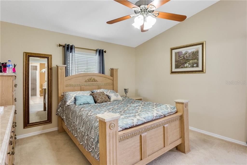 MASTER BEDROOM SUITE OFFERS VAULTED CEILINGS