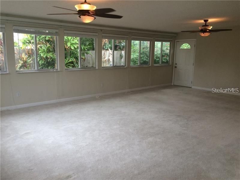The great room is large featuring a wall of double insulated windows.  Enjoy the view of the garden and easily access the back yard from this room.
