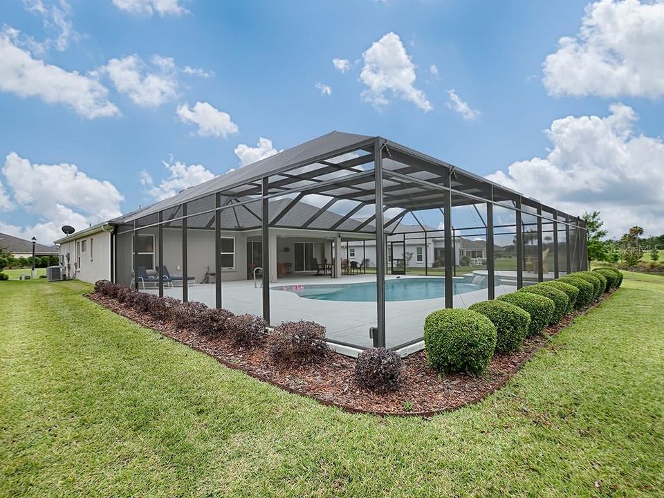 NICELY LANDSCAPED AROUND THE POOL WITH BIRDCAGE!