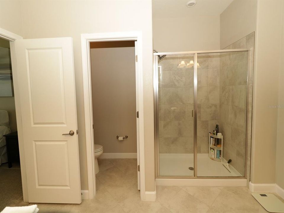 Master bath has privacy water closet and step in shower...no tub to crawl over