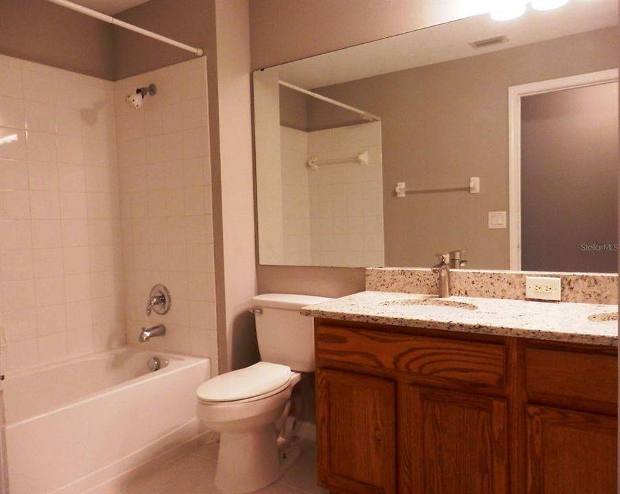 Full hall bath with tub, new granite counter top with new faucets, under mount sinks and new toilet as well.