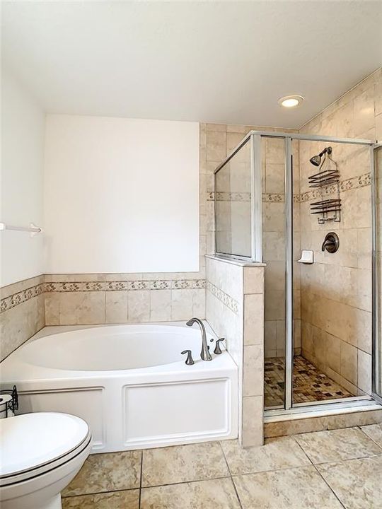 Owners bath with double sinks, garden tub and walk-in shower