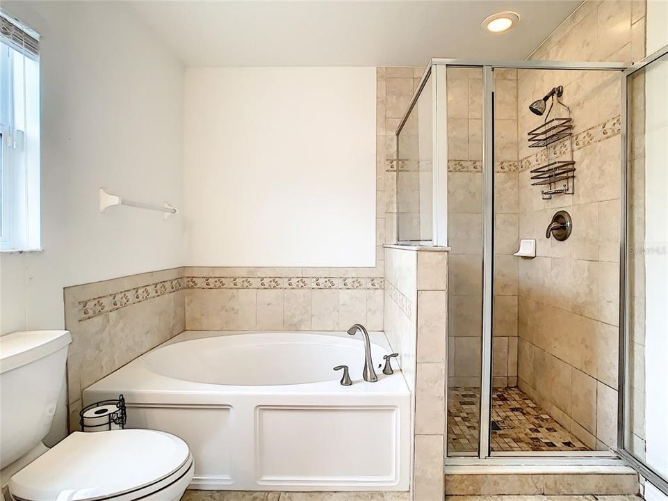 Owners bath with double sinks, garden tub and walk-in shower