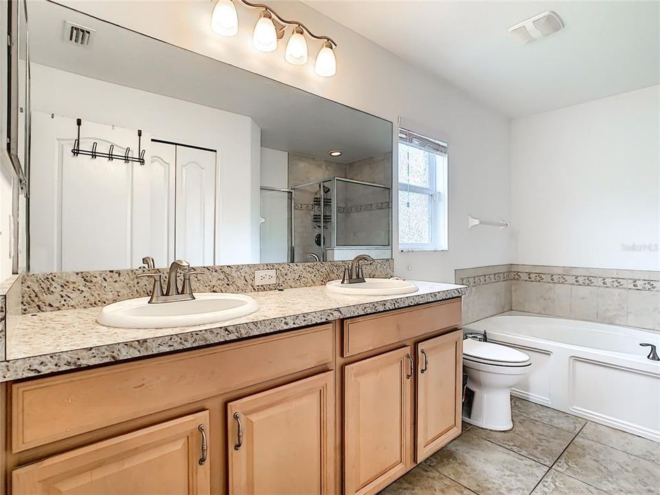 Owners bath with double sinks, garden tub and walk-in shower