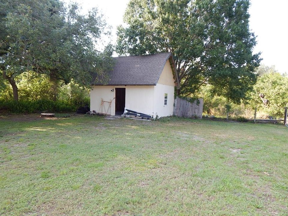 Work shop has electric and an upstairs for additional storage.