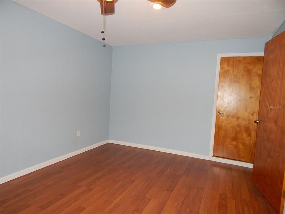 Master bedroom door opens to inside laundry and half bath.