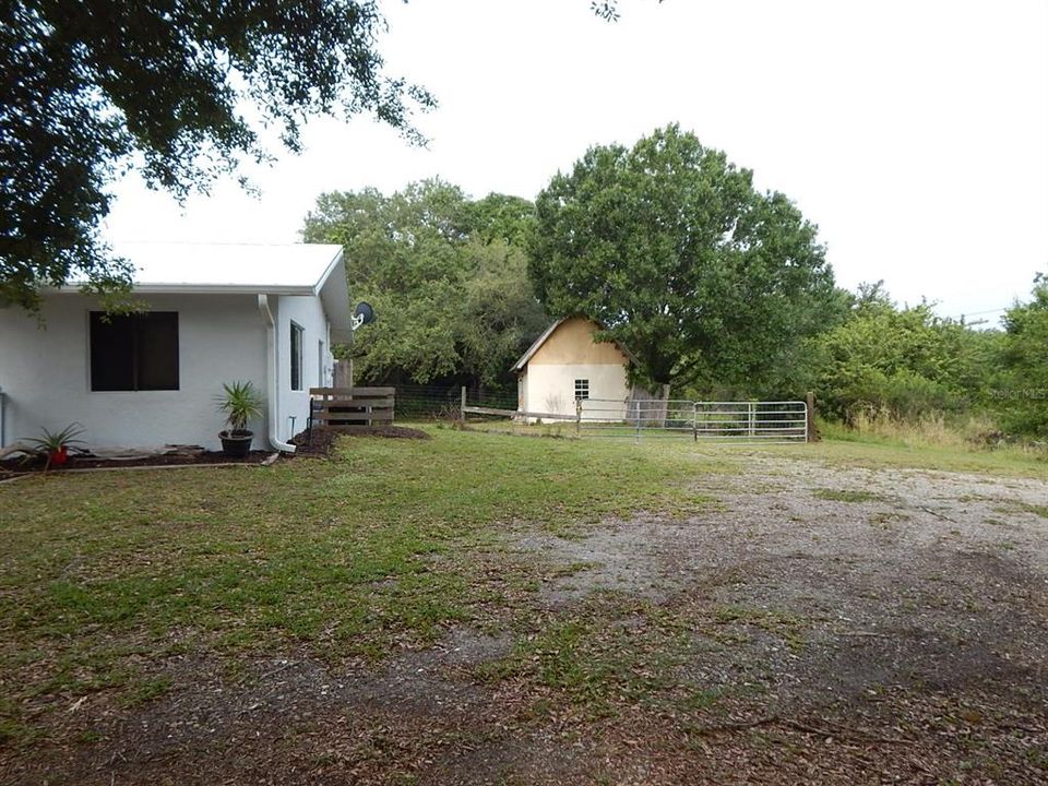 Double gate for easy access to workshop and back yard.