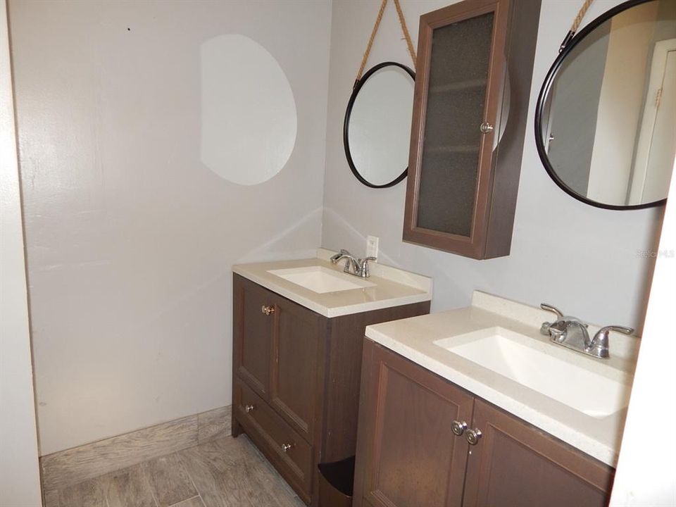 Guest bath with dual sinks.