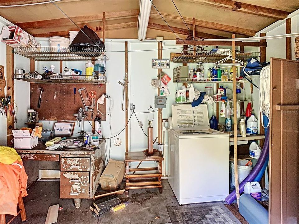 large shed interior , washer connected