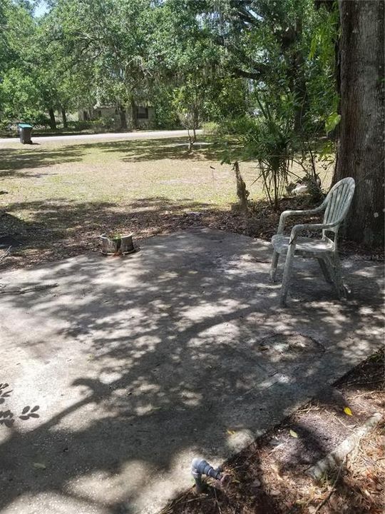 Poured concrete slab, shaded patio area.