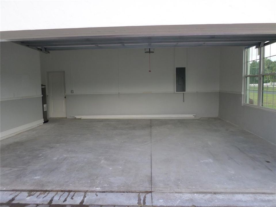 INSIDE GARAGE WITH CHAIR RAIL AND 10FT CEILING