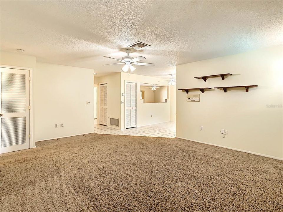 As seen from the family room, linen closet, coat closet and kitchen pantry.