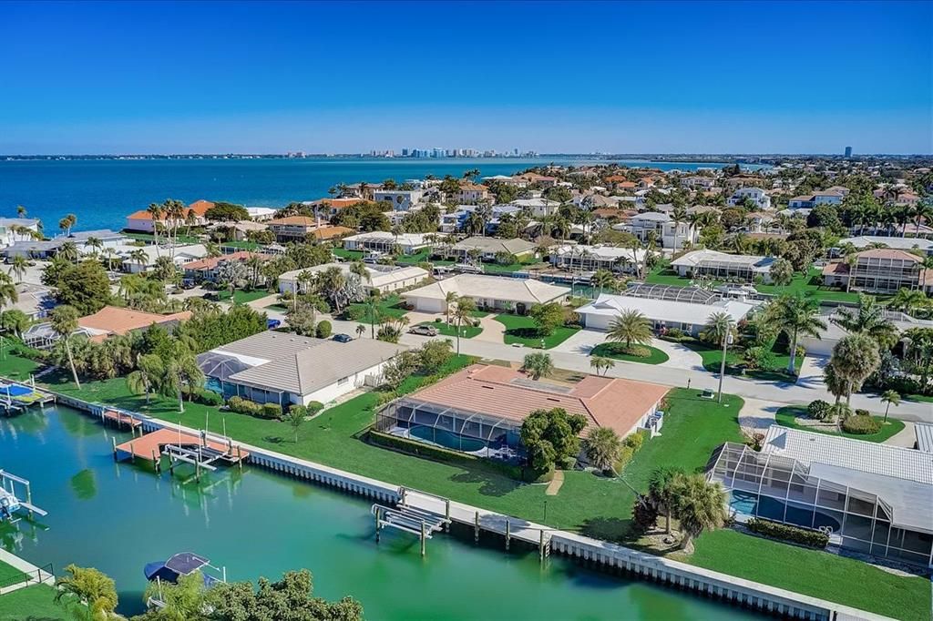 Situated on a canal and only five lots away from the open waters of Sarasota Bay, this 1969 vintage Longboat Key home offers indoor/outdoor living with wonderful canal views.