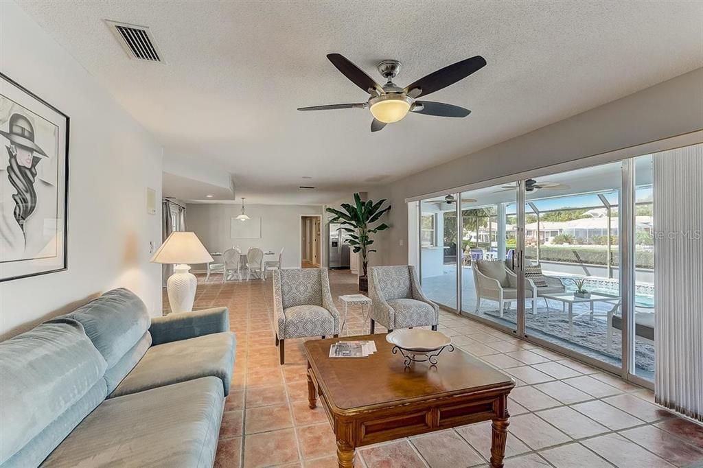 This single story home features 3 bedrooms, 2 baths, and a one garage parking spot. Sliding glass doors lead to a private pool and boat dock perfect for fishing or relaxing in the warm Florida sunshine.