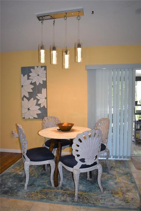Dining area in kitchen & slider to patio/pool