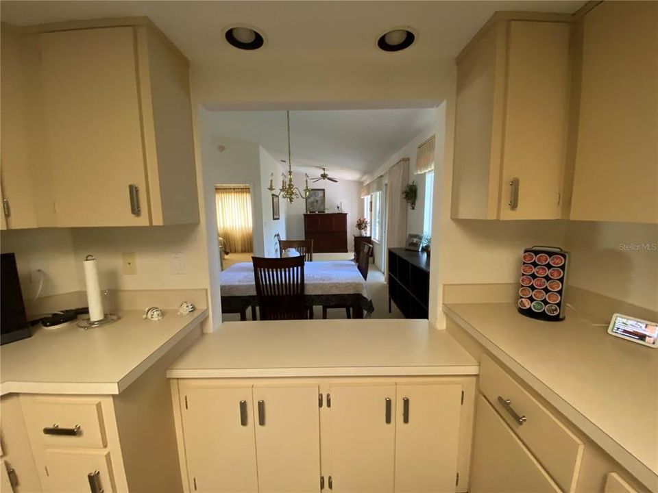 EASY TO SERVE DINNER GUESTS WITH THE PASS THRU, THIS KITCHEN HAS MANY CABINETS