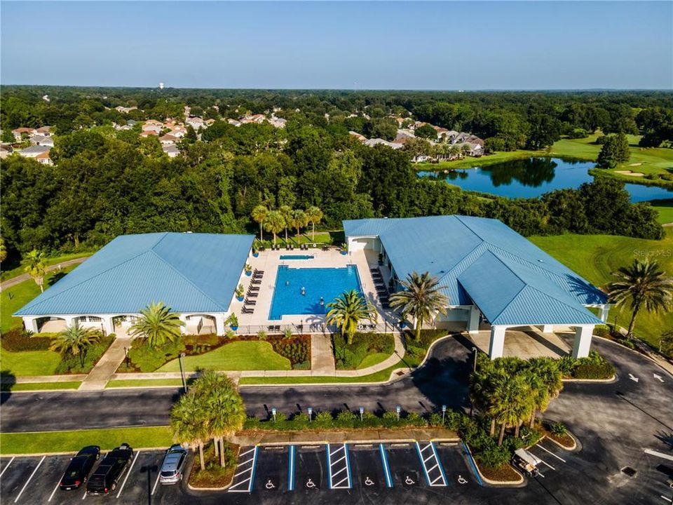 THE PALM GROVE POOL, BUILDING ON LEFT IS LARGE GYM, BUILDING ON RIGHT IS THE PALM GROVE AUDITORIUM, PART OF GOLF COURSE IS IN BACKYARD