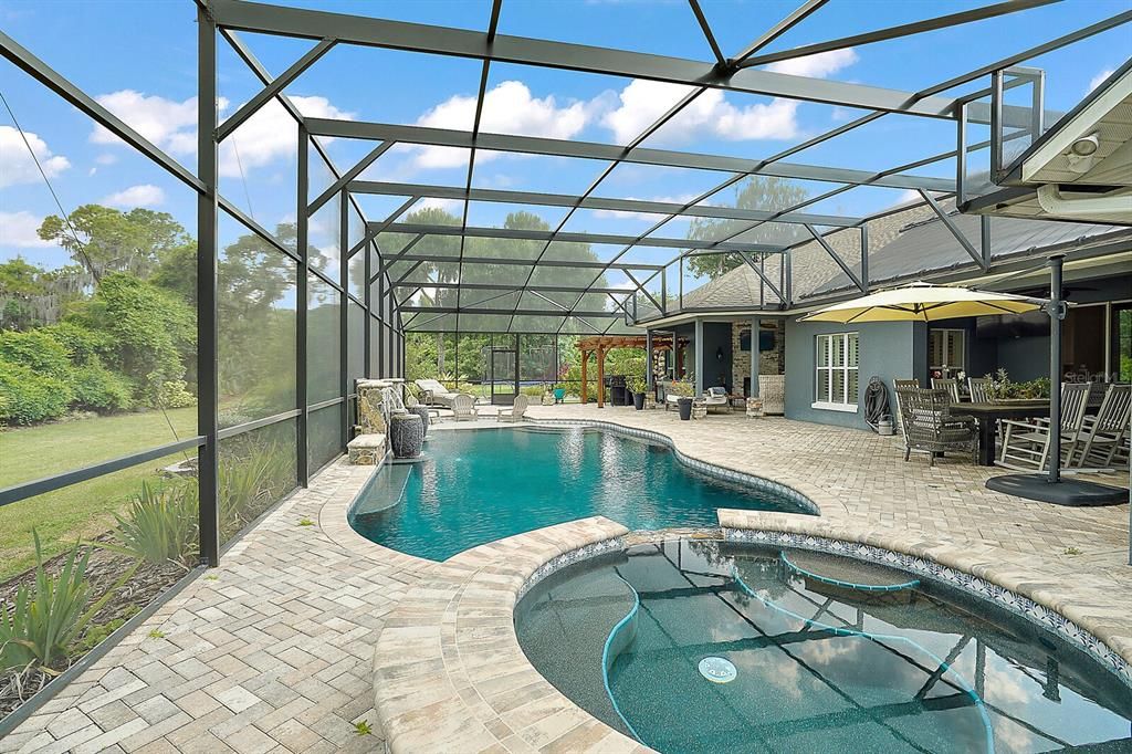 Swimming Pool and Spa and Waterfall Features, Pavers, and Covered Lanai