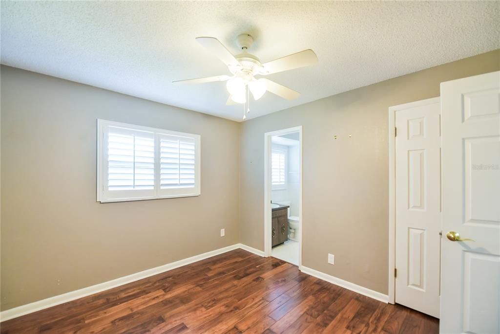 Secondary bedroom is 11x10 and includes plantation shutters, Jack and Jill Bath and large closet.