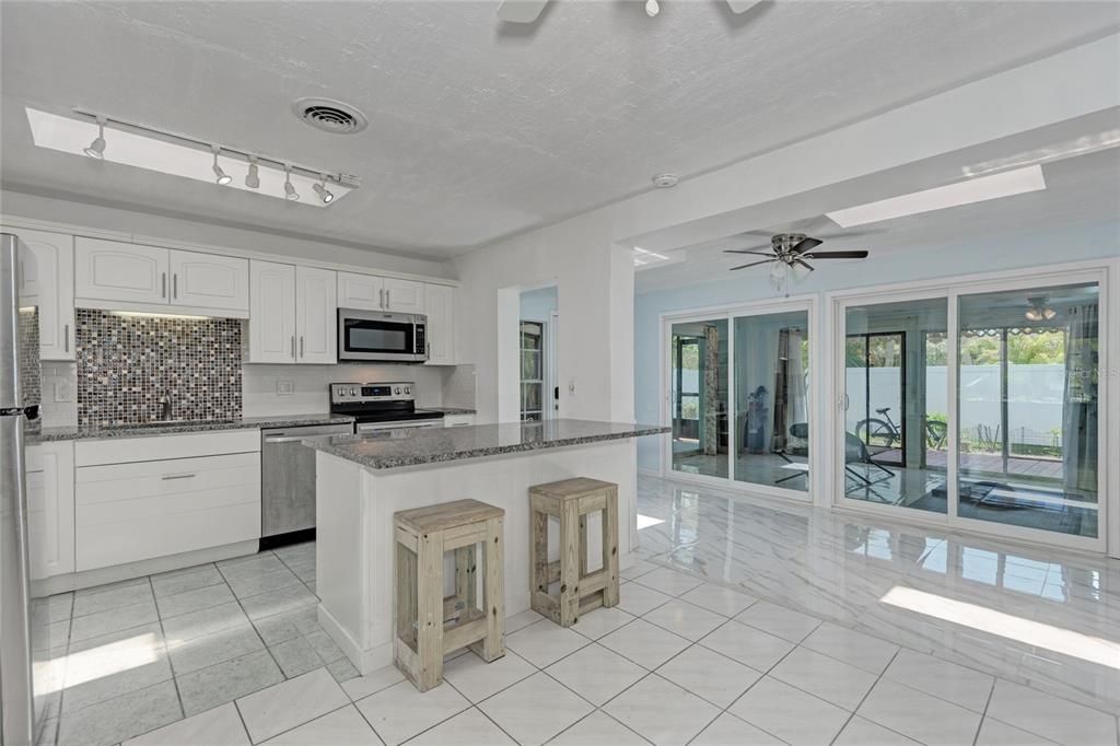 Renovated kitchen with new appliances.