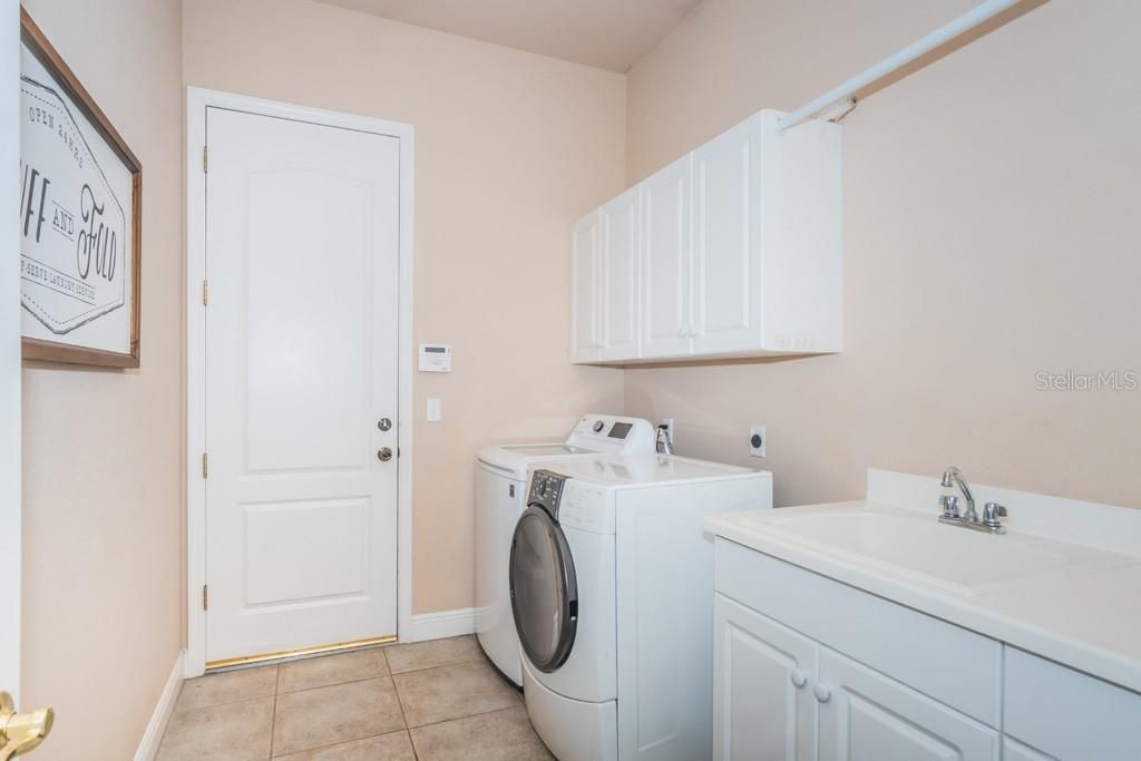 Laundry Room leading to oversized 2-Car Side Entry Garage