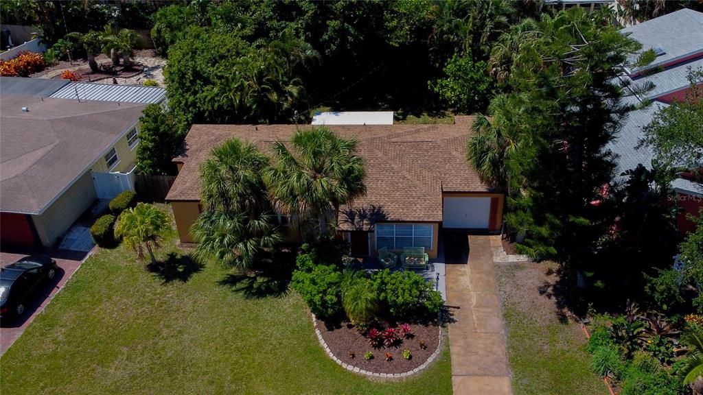 Optimal privacy and shade, surrounded by tall palm trees and beautiful tropical foliage. And, a brand spankin' new GAF Timberline HD Roof!