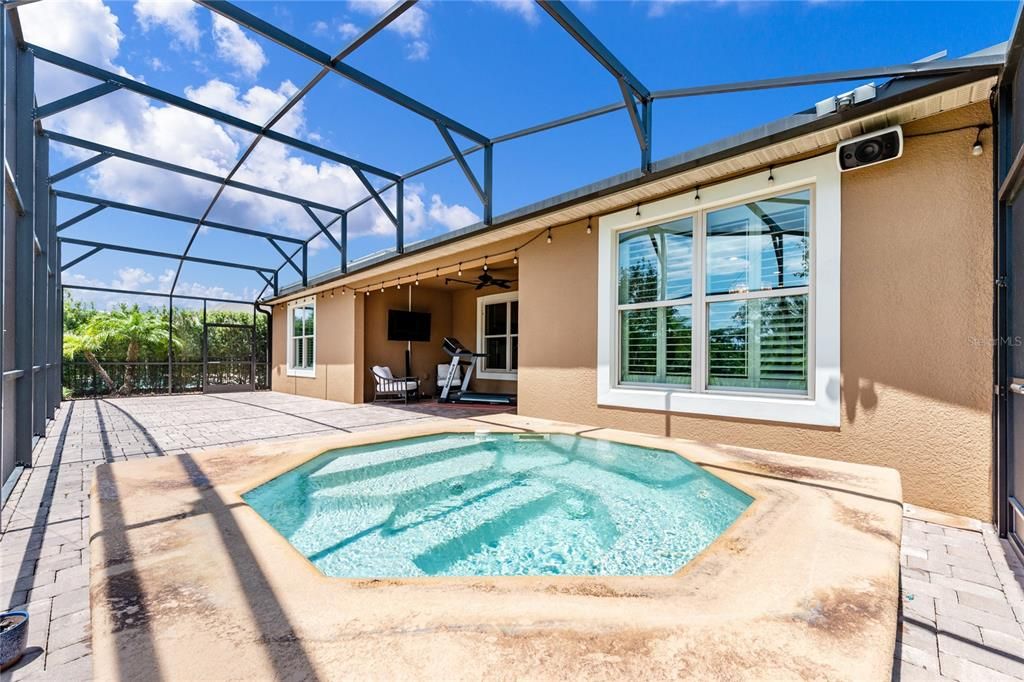 Create the outdoor living space of yours dreams on the expansive PAVER PATIO with a COVERED LANAI and sit under the stars and soak away your worries in the large CUSTOM DESIGNED IN GROUND SPA/go no heat and cool off in your own personal POOL - all FULLY SCREENED!