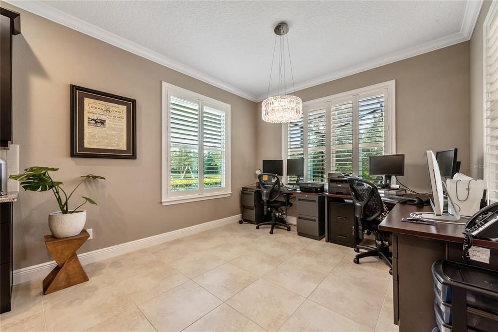 BREAKFAST NOOK has the lovely PLANTATION SHUTTERS that run throughout the home!