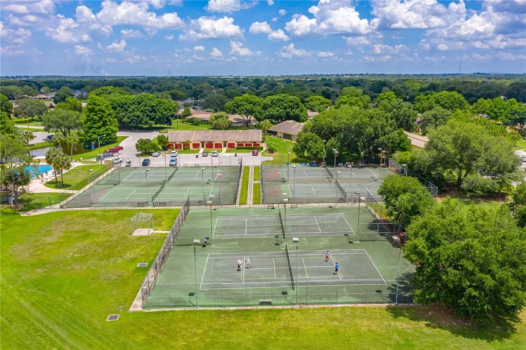AERIAL VIEW OF COMMUNITY TENNIS COURTS. COMMUNITY POOL IS TO THE LEFT.