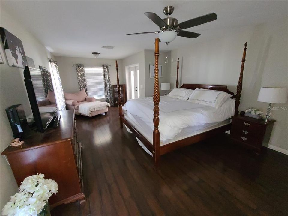 Spacious Master Bedroom with sitting area and door leading to lanai