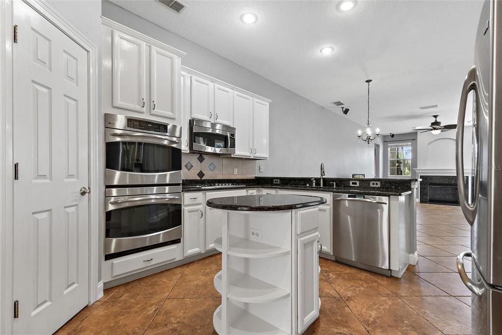 Enjoy this on trend and classic white kitchen with stainless steel appliances, granite, and tons of storage