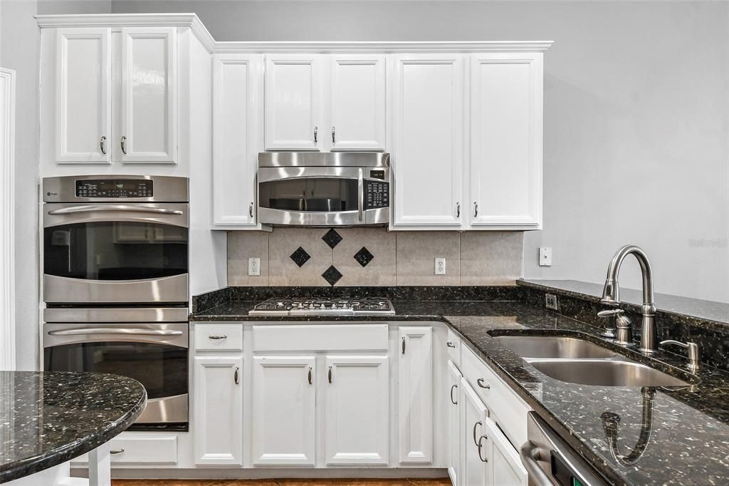 Classic white kitchen! White kitchens are in high demand and enjoy the bright and airy feel of this kitchen with the open floor plan. Great house to entertain.