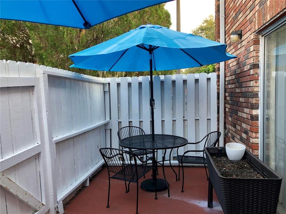 Private patio tucked just off the eat-in-kitchen perfect for casual outdoor dining