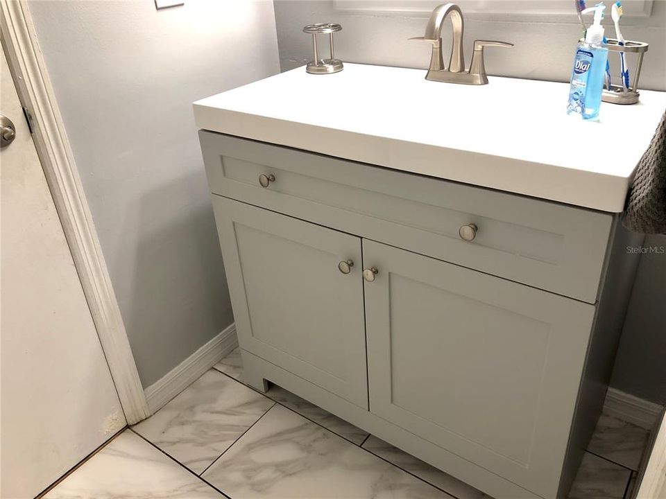 Remodeled upstairs bathroom w/ new vanity, sink and faucet.