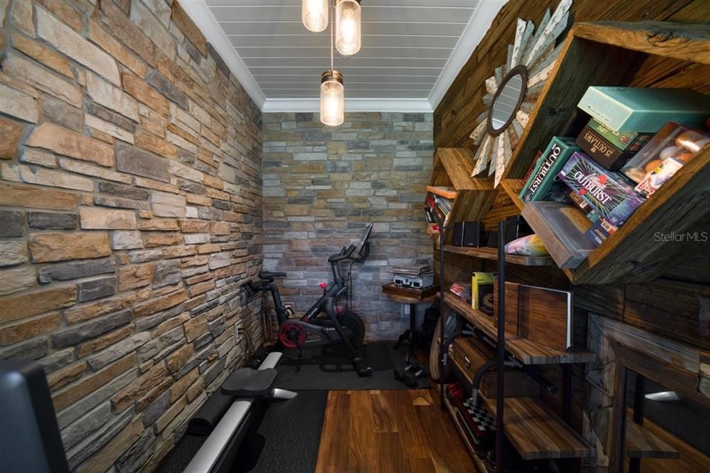 CUSTOM-BUILT WINE ROOM WITH STONE WALLS AND WOOD FLOORS ~ CURRENTLY BEING USED AS A FLEX SPACE