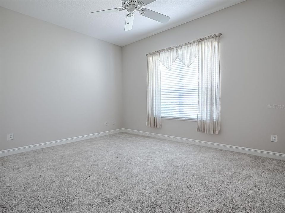 SPACIOUS FRONT GUEST BEDROOM.