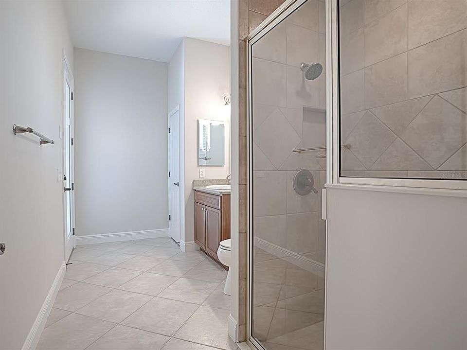 3RD BATHROOM WITH LINEN CLOSET, GRANITE COUNTERTOPS, SHOWER AND ACCESS TO THE POOL AREA!