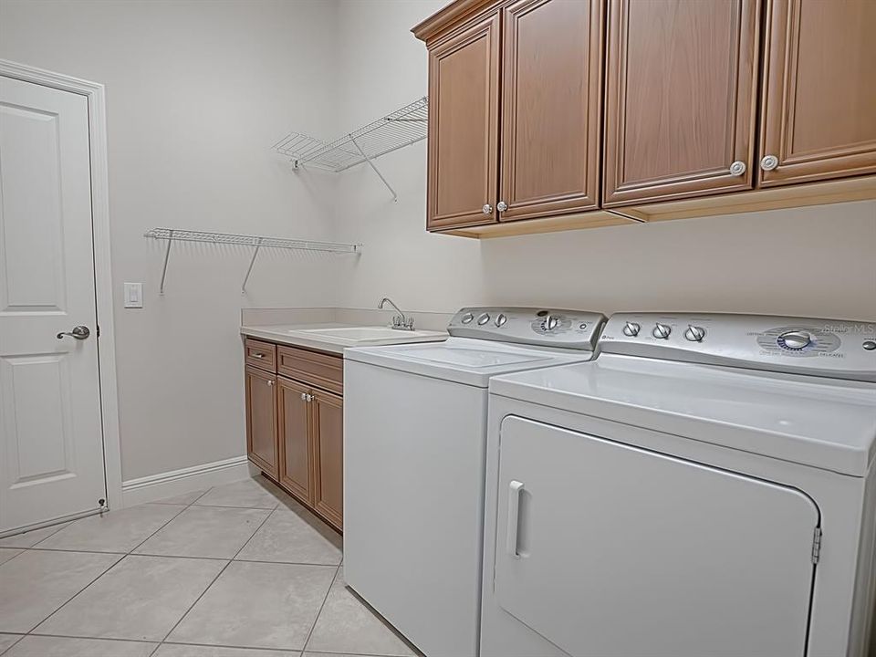 LAUNDRY WITH WASH OUT SINK AND EXTRA STORAGE CABINETS, WASHER AND DRYER CONVEY!