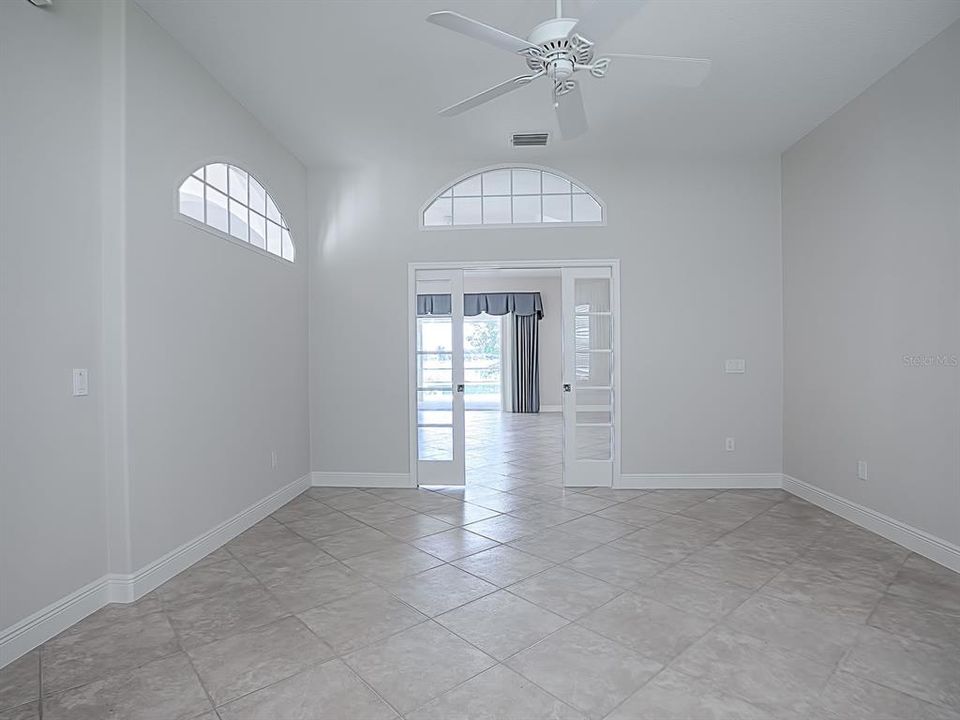 LOOKING OUT TO THE LIVING ROOM FROM THE DEN.