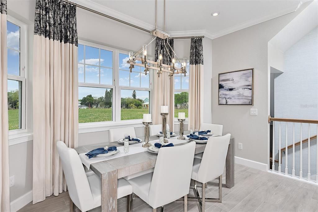 REPRESENTATIVE PHOTO. Always feel at home in this cozy casual dining nook surrounded by beautiful windows in the END UNIT!