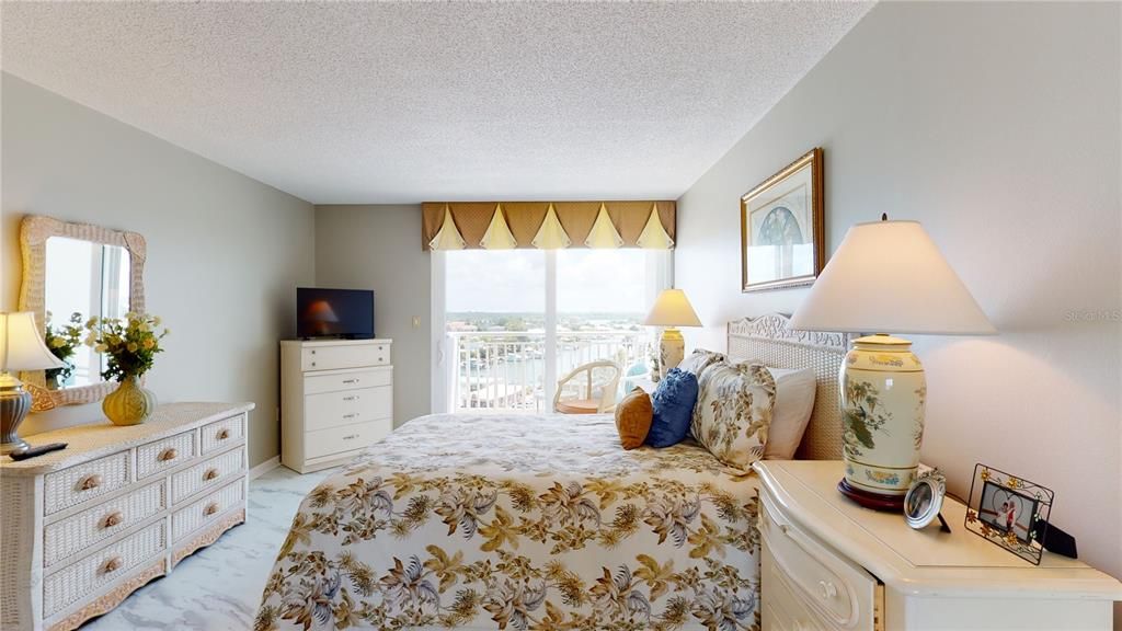 The primary bedroom has sliding doors opening to a balcony over looking the intracoastal waterway. The eastern view from the room enjoys the sunrise.