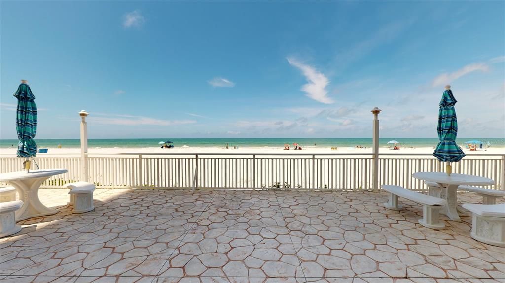 The patio is a great place to enjoy activities and walk down to the beach.