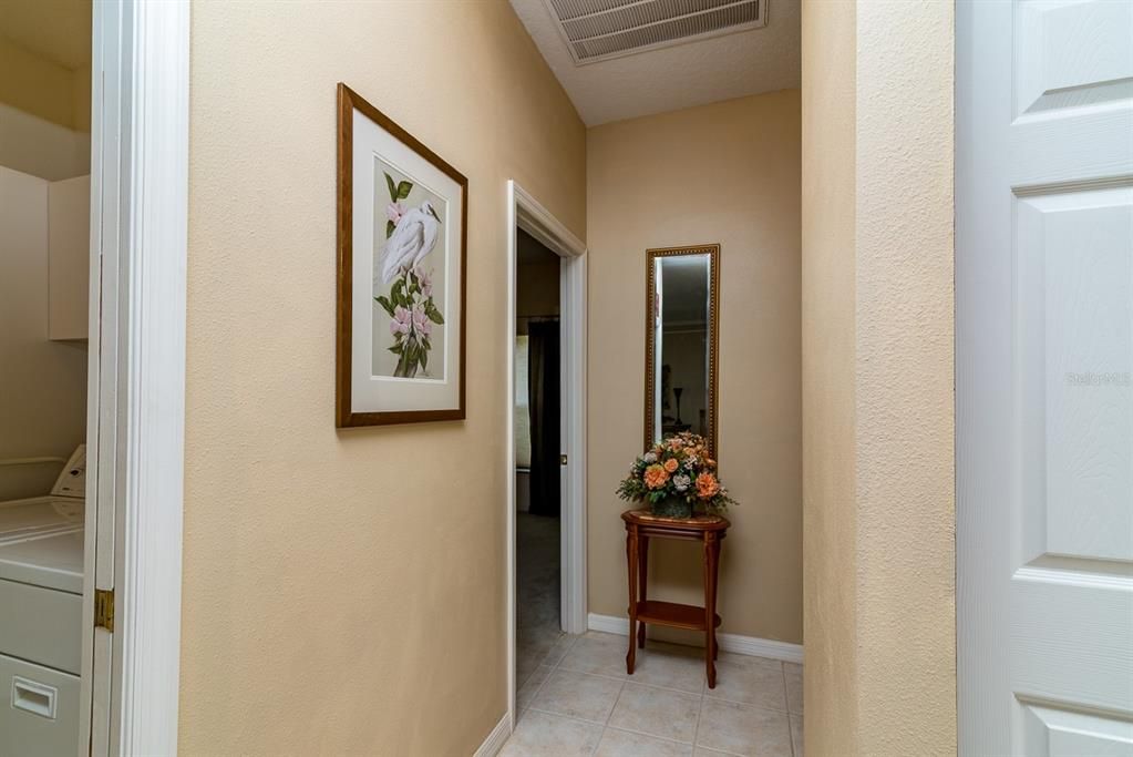 This hallway off the kitchen leads to the guest area.